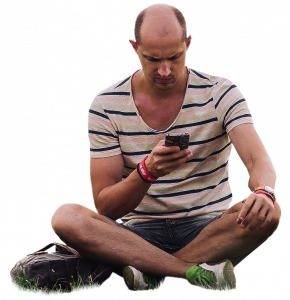 man on grass with phone 26