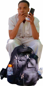 402-man-sitting-phone-backpack.png 80